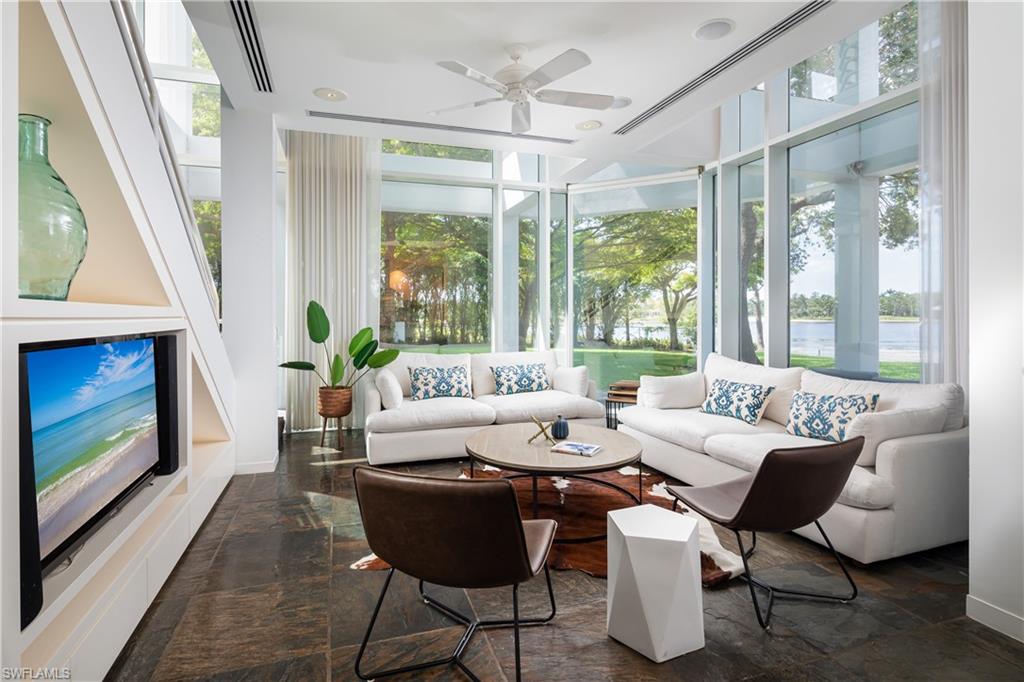 427 Ridge Court Naples, FL 34108 - Photo 13 of 49 a living room with furniture and a fireplace