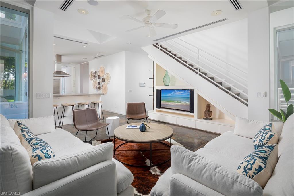 427 Ridge Court Naples, FL 34108 - Photo 14 of 49 a living room with furniture and a wooden floor
