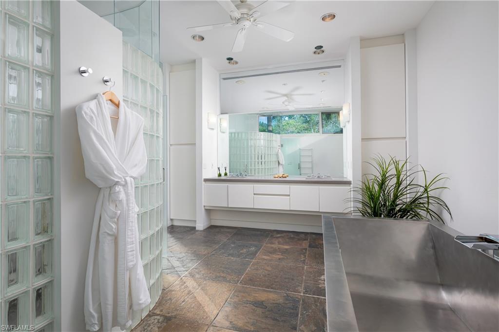 427 Ridge Court Naples, FL 34108 - Photo 16 of 49 a bathroom with a tub and shower