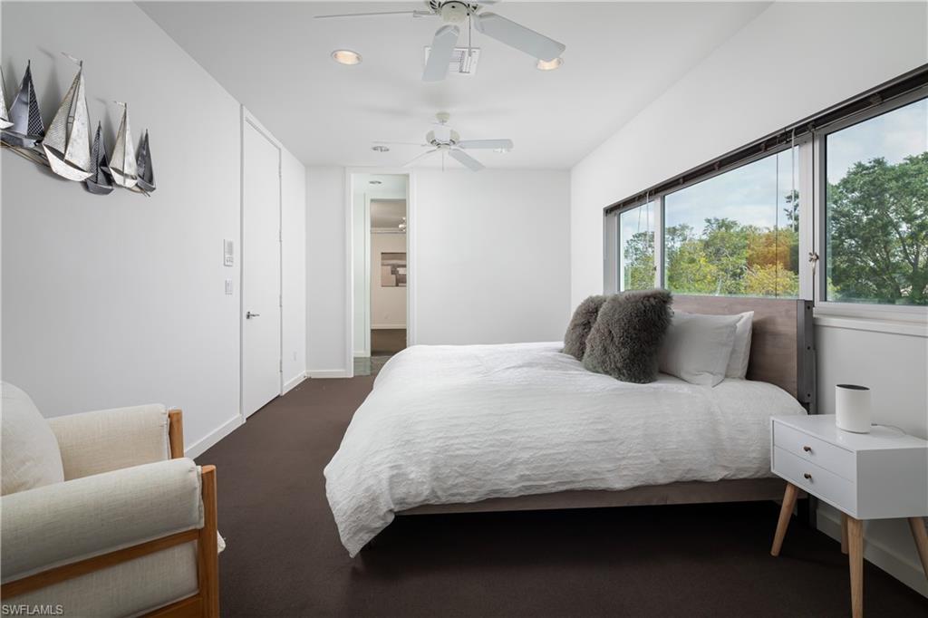 427 Ridge Court Naples, FL 34108 - Photo 18 of 49 a bedroom with bed and window