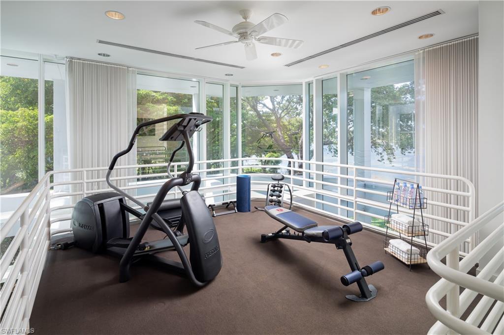 427 Ridge Court Naples, FL 34108 - Photo 24 of 49 a room with gym equipment and a large window