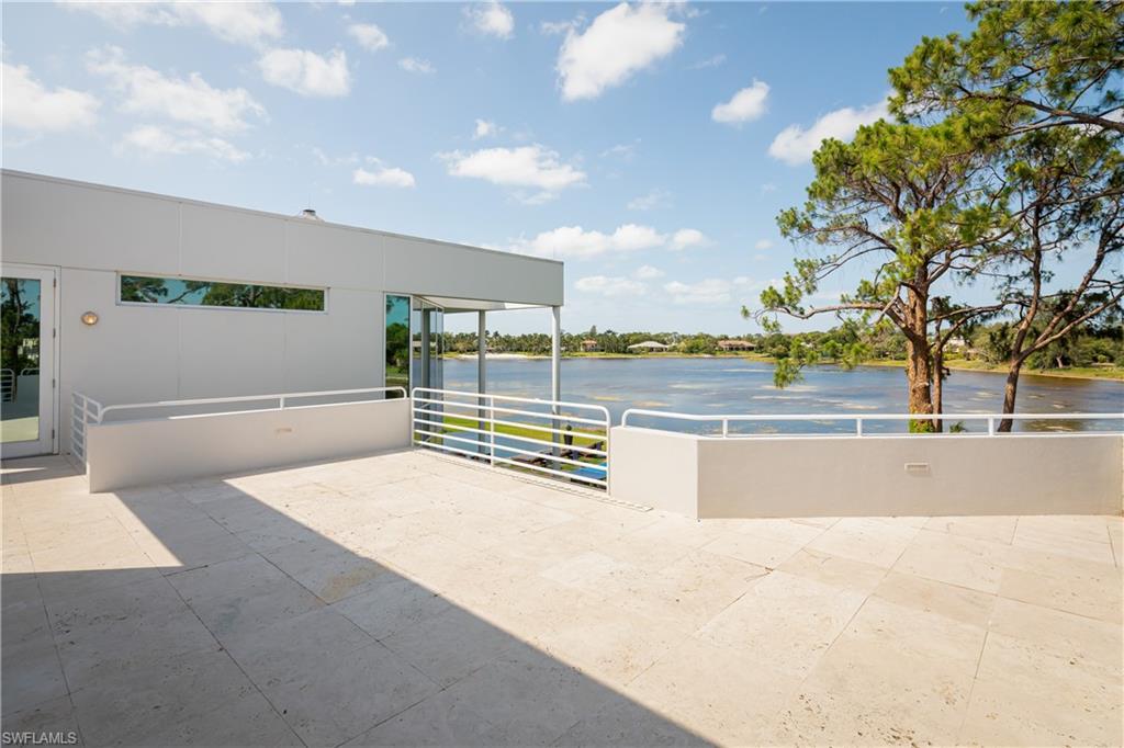 427 Ridge Court Naples, FL 34108 - Photo 26 of 49 a view of a swimming pool and an outdoor space