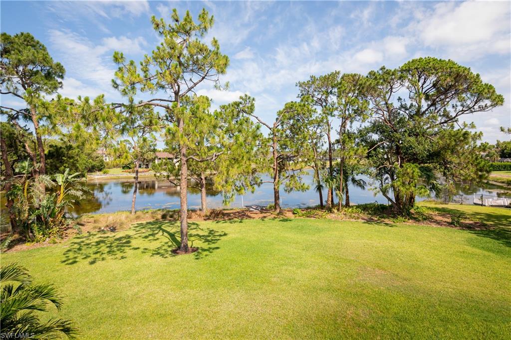 427 Ridge Court Naples, FL 34108 - Photo 28 of 49 a view of swimming pool with an outdoor space and seating area