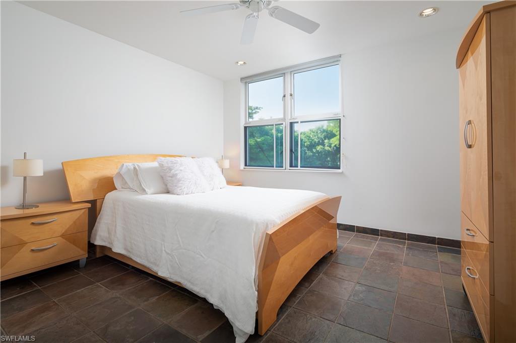 427 Ridge Court Naples, FL 34108 - Photo 33 of 49 a bedroom with a bed and window