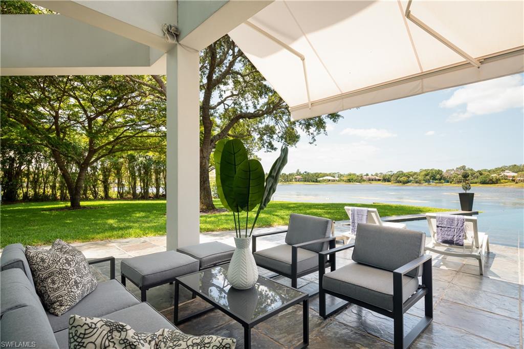 427 Ridge Court Naples, FL 34108 - Photo 35 of 49 a view of swimming pool and lake view