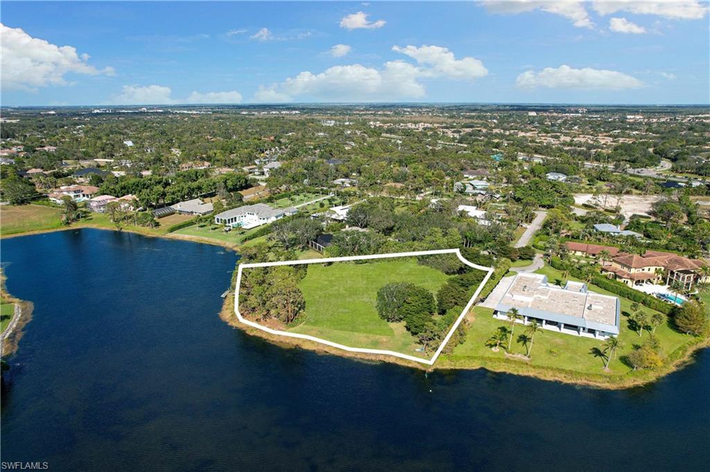 427 Ridge Court Naples, FL 34108 - Photo 47 of 49 a view of a swimming pool with an ocean view