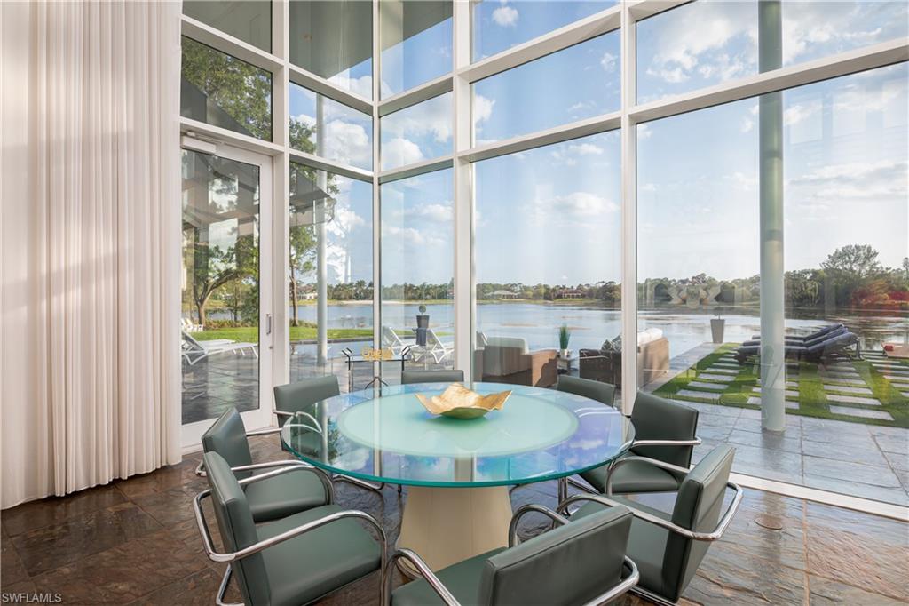 427 Ridge Court Naples, FL 34108 - Photo 7 of 49 a view of a dining room with a table and chairs