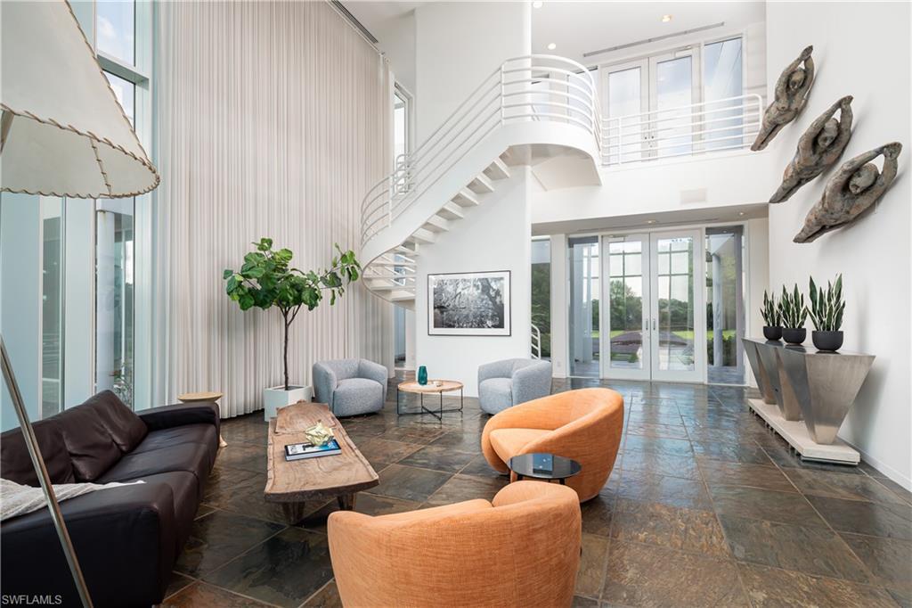 427 Ridge Court Naples, FL 34108 - Photo 9 of 49 a living room with furniture and a large window