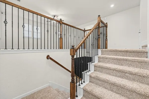a bathroom with a granite countertop sink a toilet and a mirror