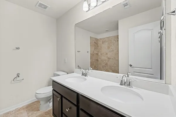 a view of a livingroom with a ceiling fan and window