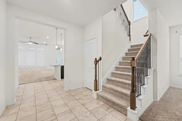 a kitchen with stainless steel appliances granite countertop a sink and a refrigerator