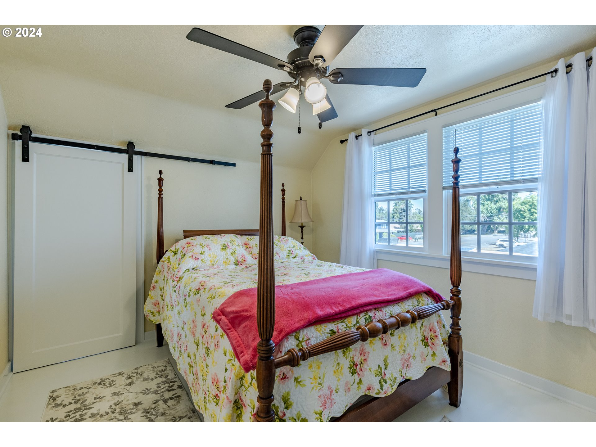 3923 Jasper Road Springfield, OR 97478 - Photo 18 of 48 a bedroom with a bed window and a ceiling fan
