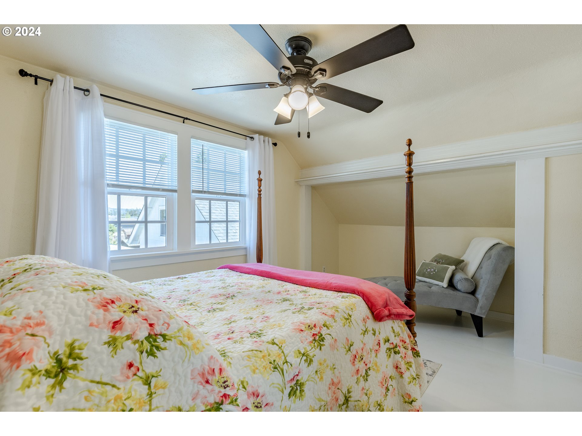 3923 Jasper Road Springfield, OR 97478 - Photo 19 of 48 a bedroom with a bed and a chandelier