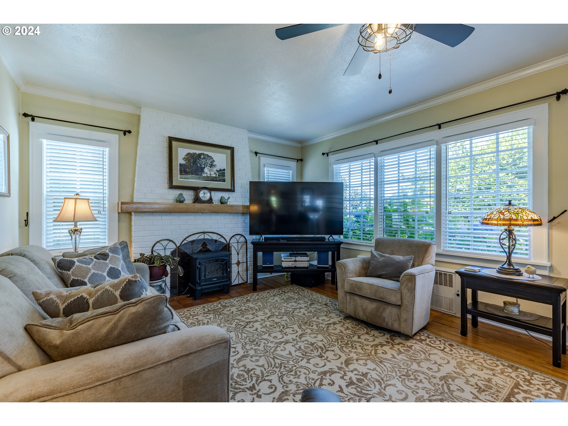 3923 Jasper Road Springfield, OR 97478 - Photo 8 of 48 a living room with furniture and a flat screen tv
