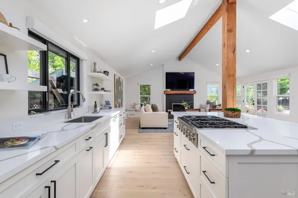 a view of a living room and bathroom