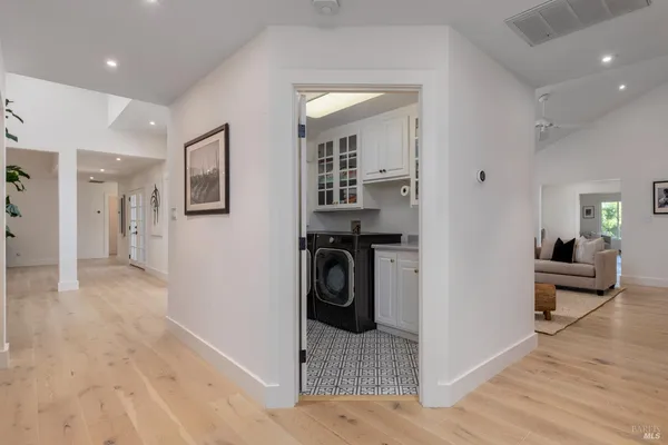 a living room with furniture and a floor to ceiling window