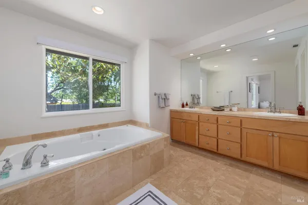 an aerial view of a house with a yard and garden