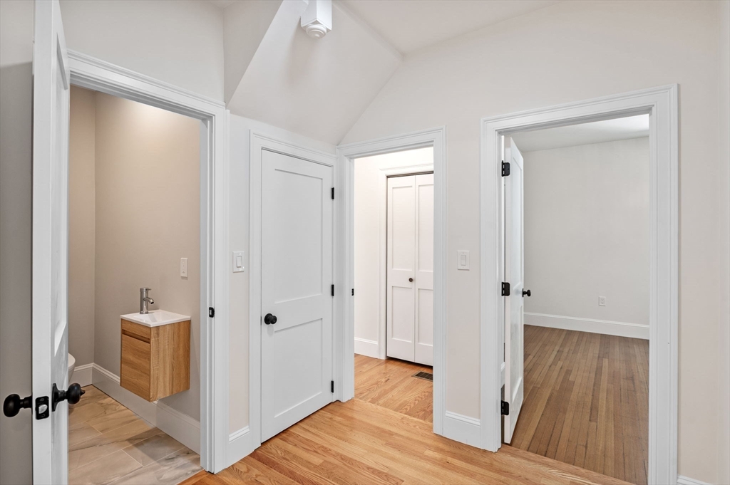 8 Cushing Street, Unit 1 Salem, MA 01970 - Photo 14 of 35 a view of a hallway with wooden floor and closet area