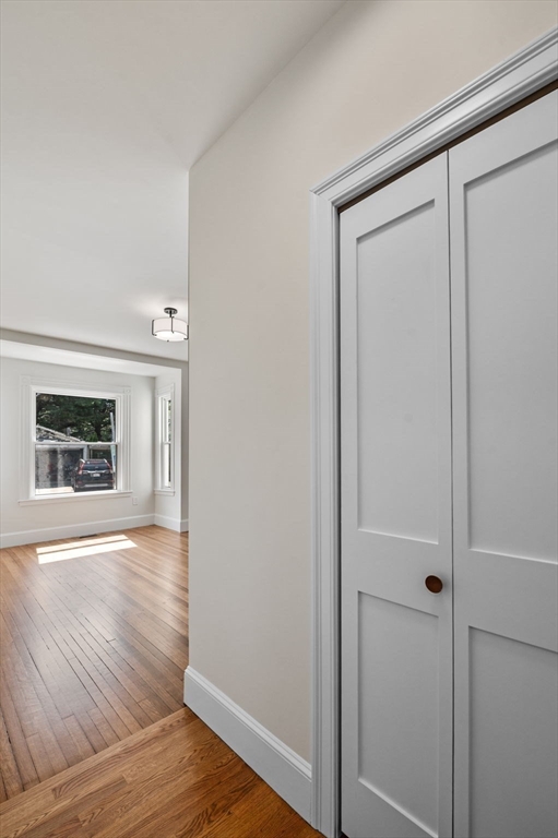 8 Cushing Street, Unit 1 Salem, MA 01970 - Photo 15 of 35 a view of an empty room with wooden floor and a window