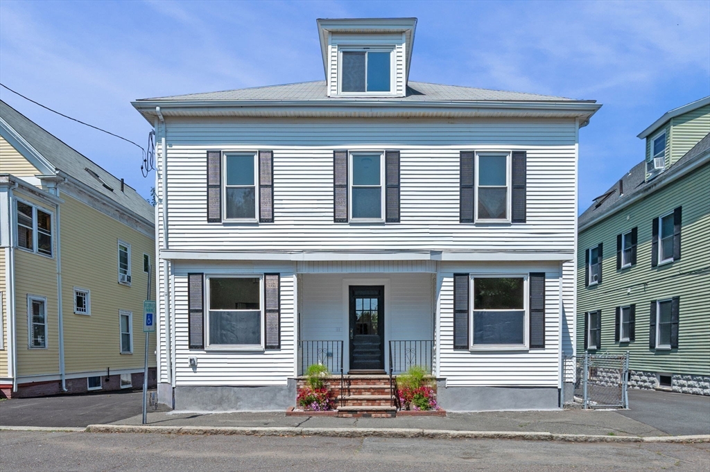 8 Cushing Street, Unit 1 Salem, MA 01970 - Photo 19 of 35 a front view of residential houses
