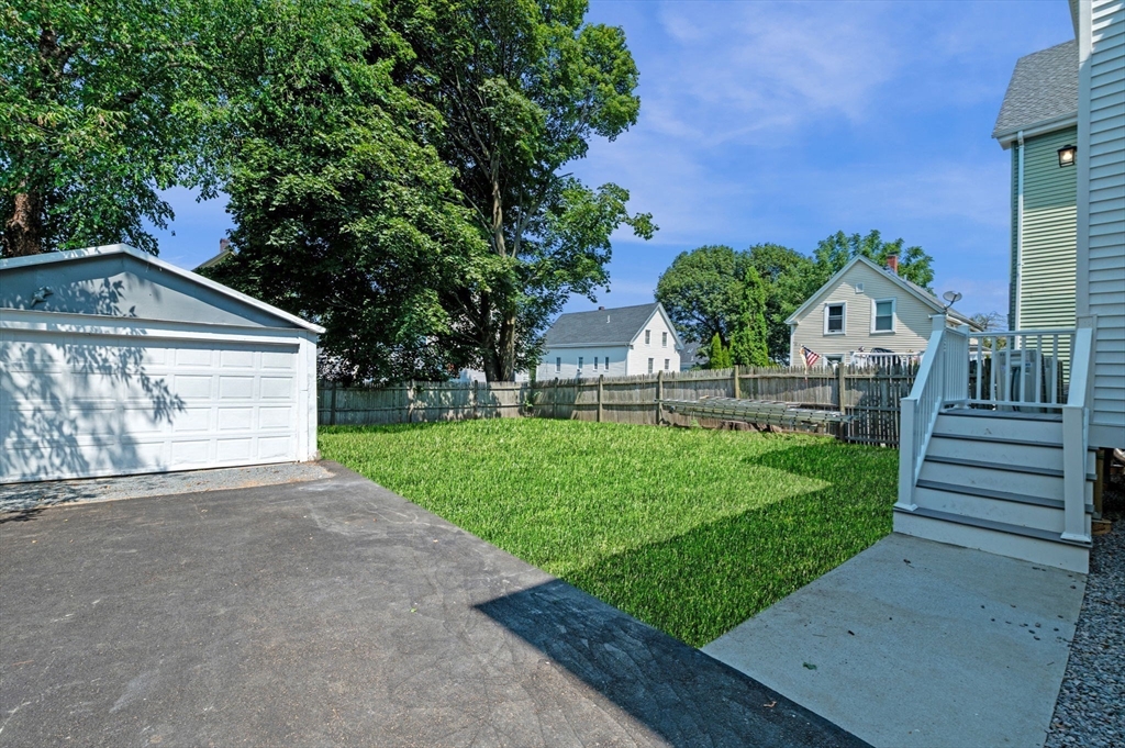 8 Cushing Street, Unit 1 Salem, MA 01970 - Photo 23 of 35 a front view of a house with a yard