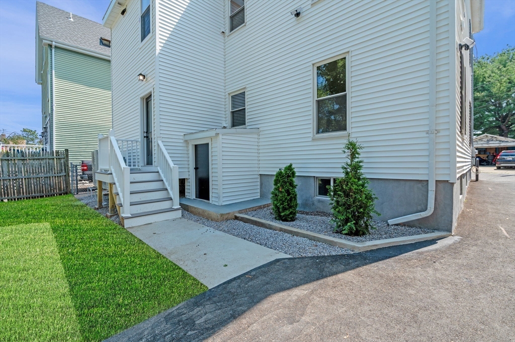 8 Cushing Street, Unit 1 Salem, MA 01970 - Photo 24 of 35 a view of a house with backyard and a garden