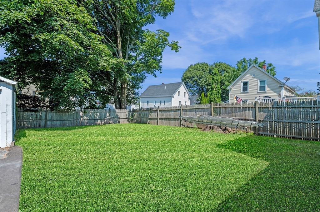 8 Cushing Street, Unit 1 Salem, MA 01970 - Photo 26 of 35 a view of a garden with a house in the background