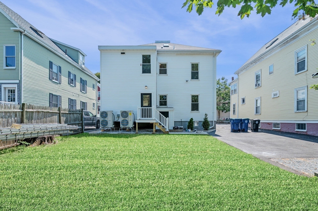 8 Cushing Street, Unit 1 Salem, MA 01970 - Photo 28 of 35 a view of a house with a yard and sitting area