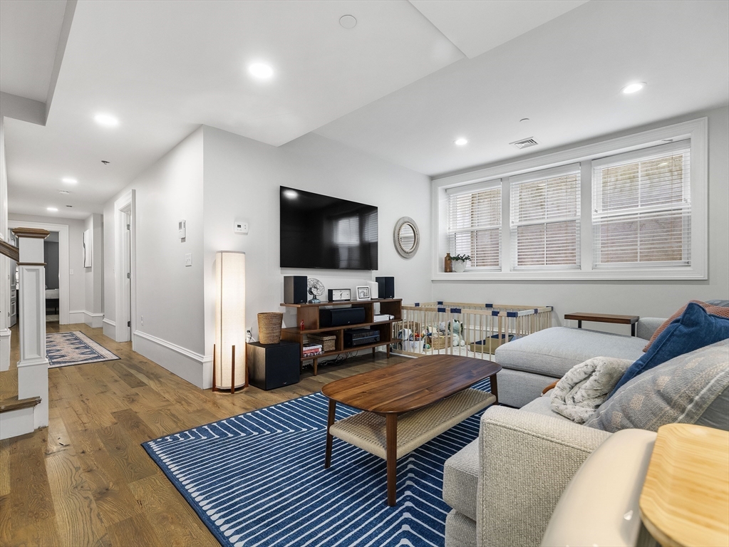 711 East 2nd Street, Unit 2 Boston, MA 02127 - Photo 11 of 25 a living room with furniture and a flat screen tv