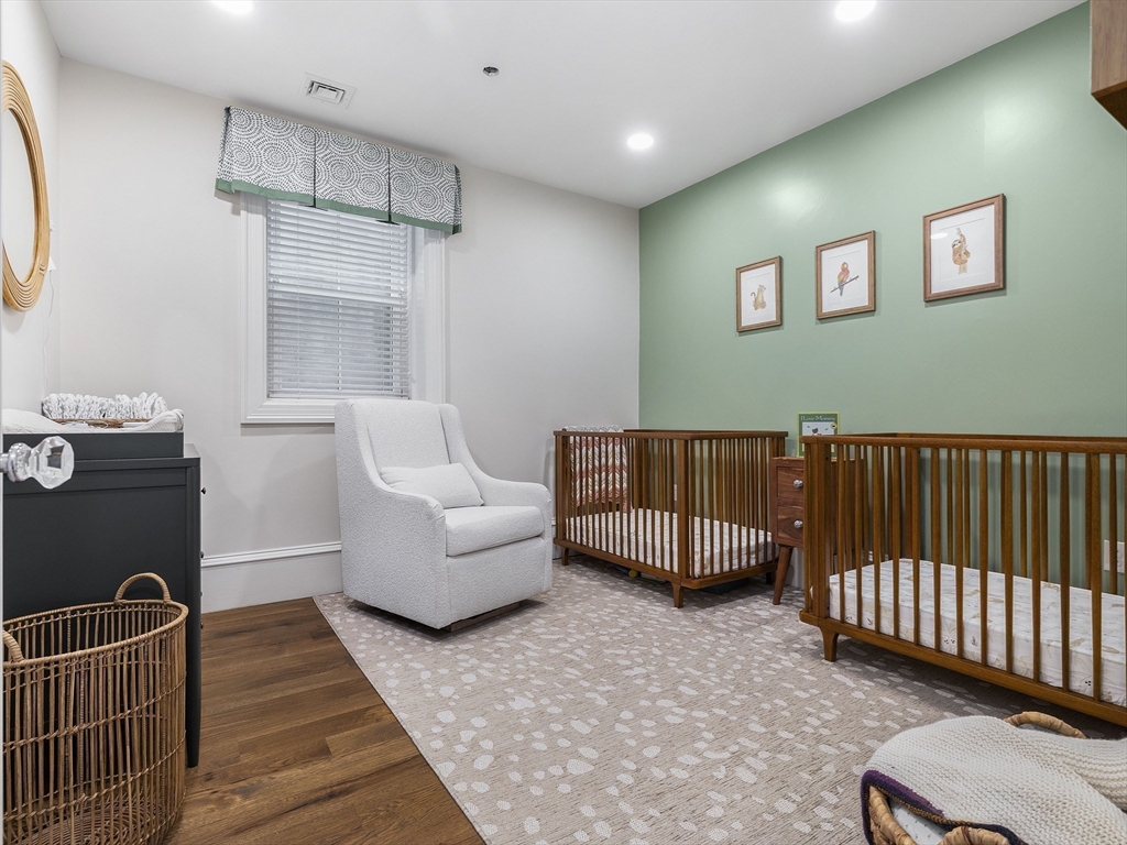 711 East 2nd Street, Unit 2 Boston, MA 02127 - Photo 14 of 25 a living room with furniture and a window