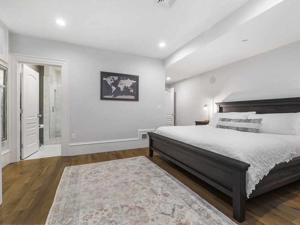 711 East 2nd Street, Unit 2 Boston, MA 02127 - Photo 16 of 25 a bedroom with a bed and a couch