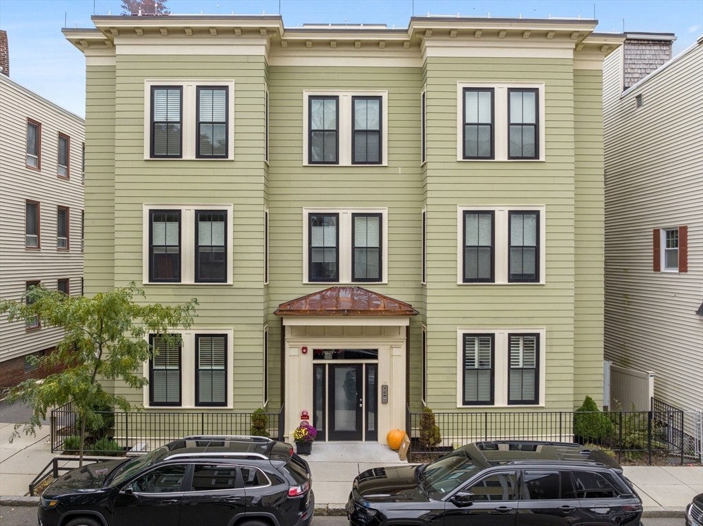 711 East 2nd Street, Unit 2 Boston, MA 02127 - Photo 19 of 25 a couple of cars parked in front of a building