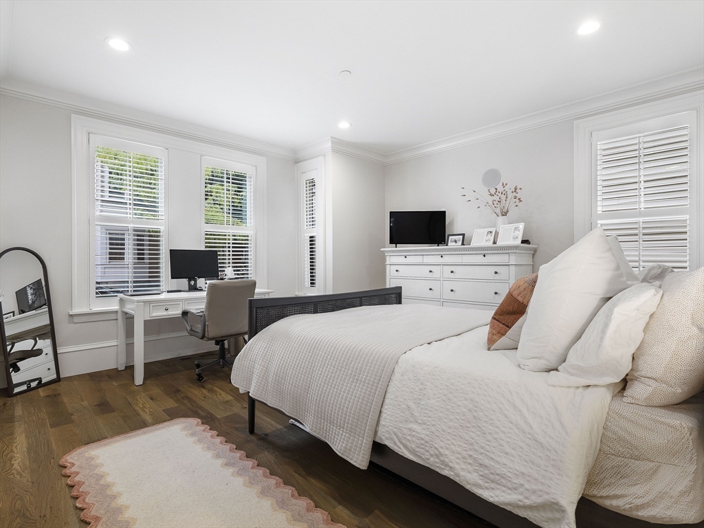 711 East 2nd Street, Unit 2 Boston, MA 02127 - Photo 7 of 25 a bedroom with a bed and a couch