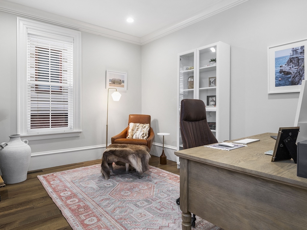 711 East 2nd Street, Unit 2 Boston, MA 02127 - Photo 8 of 25 a bedroom with a bed and wooden floor