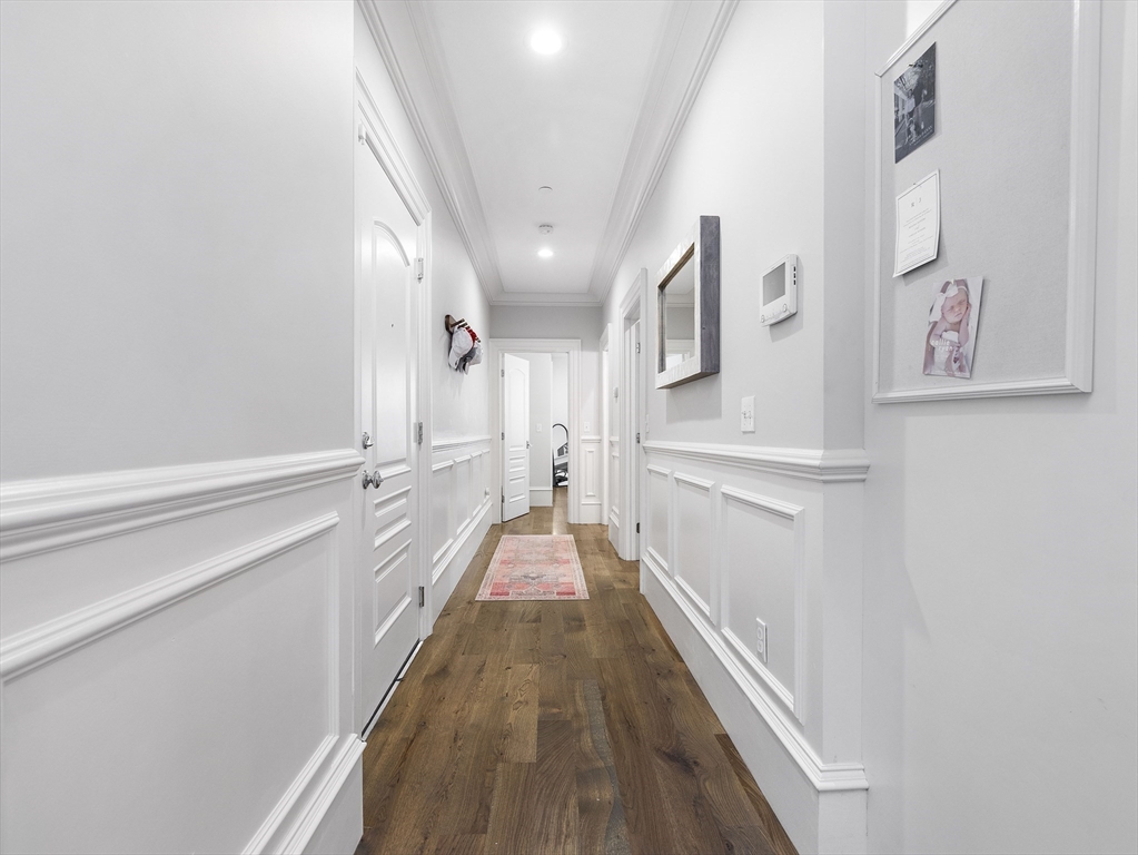 711 East 2nd Street, Unit 2 Boston, MA 02127 - Photo 10 of 25 a view of a hallway with wooden floor and staircase