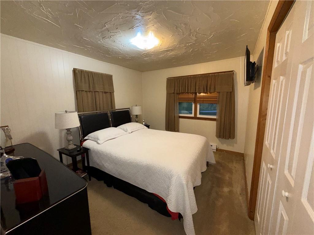 1637 Highway 981 Ruffs Dale, PA 15679 - Photo 6 of 11 a bedroom with a bed and a window