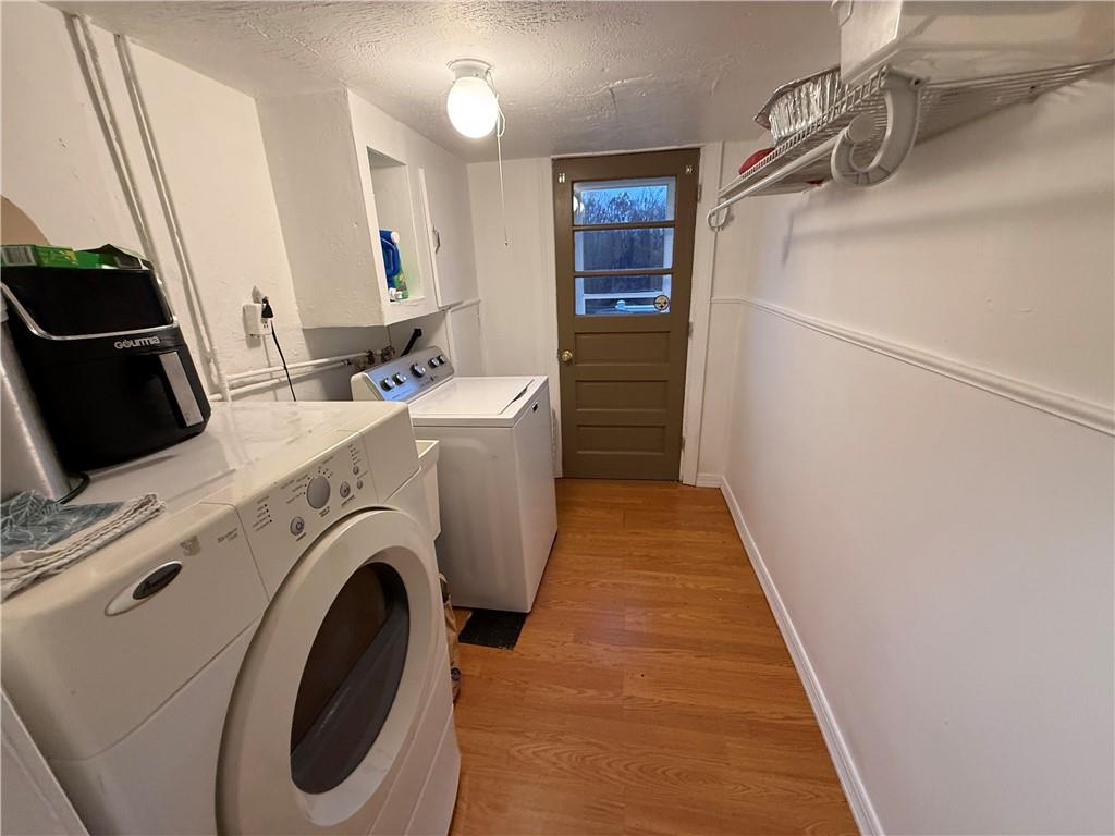 1637 Highway 981 Ruffs Dale, PA 15679 - Photo 10 of 11 a view of washer and dryer with bathroom in the background