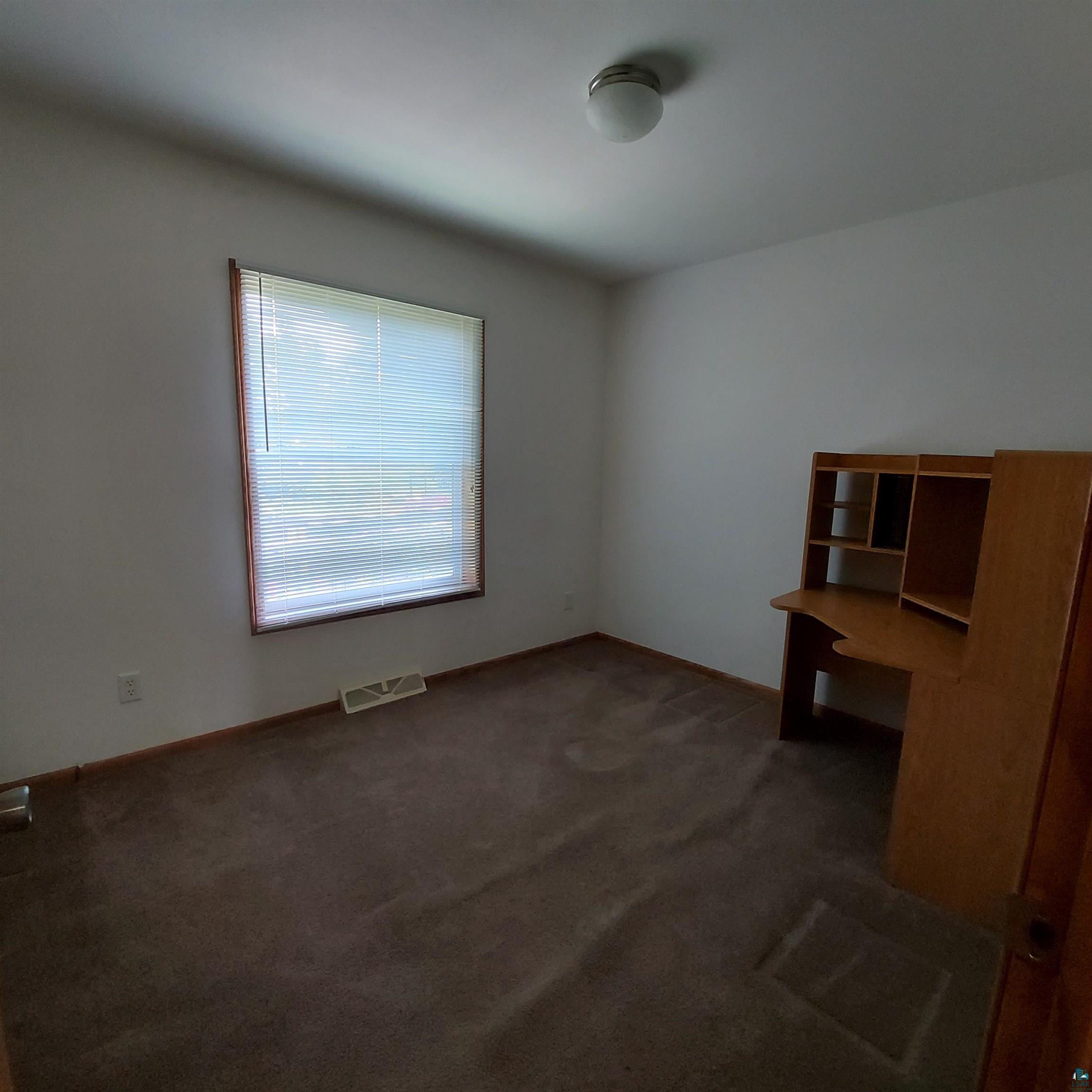 6563 Seville Road Saginaw, MN 55779 - Photo 18 of 28 Interior space featuring carpet floors and a healthy amount of sunlight