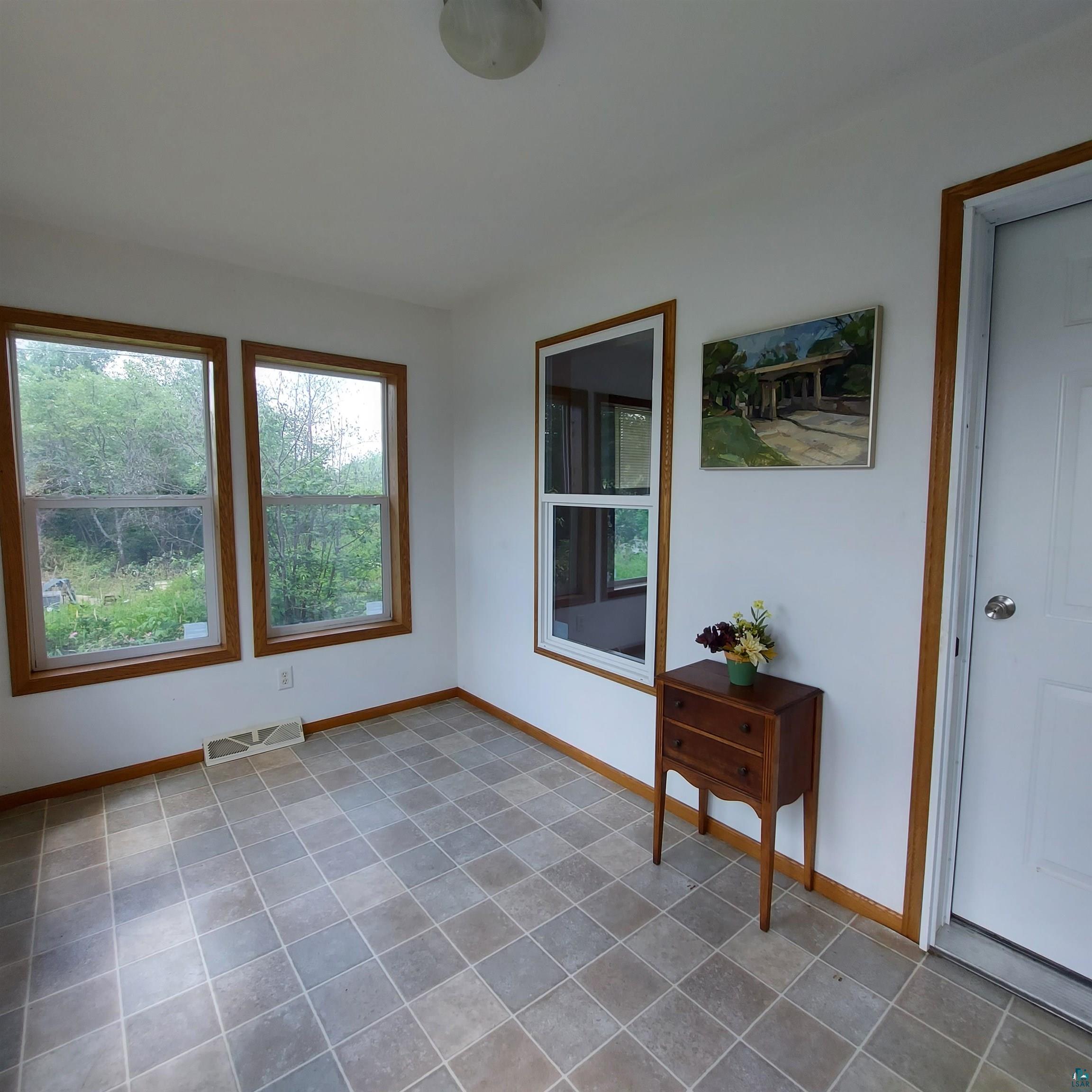 6563 Seville Road Saginaw, MN 55779 - Photo 7 of 28 Empty room featuring tile patterned flooring