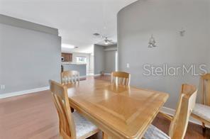 1664 Portsmouth Lake Drive Brandon, FL 33511 - Photo 18 of 38 a dining room with furniture and wooden floor