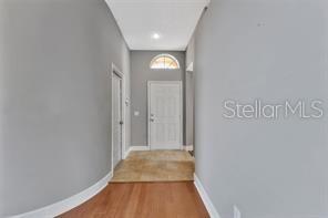 1664 Portsmouth Lake Drive Brandon, FL 33511 - Photo 20 of 38 a view of a hallway with wooden floor