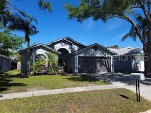 1664 Portsmouth Lake Drive Brandon, FL 33511 - Photo 2 of 38 a view of a house with a yard