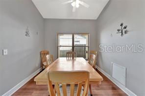 1664 Portsmouth Lake Drive Brandon, FL 33511 - Photo 21 of 38 a view of a dining room with furniture window and wooden floor