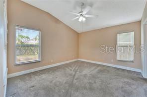 1664 Portsmouth Lake Drive Brandon, FL 33511 - Photo 32 of 38 an empty room with windows and fan