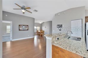 1664 Portsmouth Lake Drive Brandon, FL 33511 - Photo 10 of 38 a view of a living room and chandelier fan