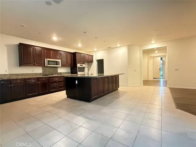 a large bathroom with a large tub and sink