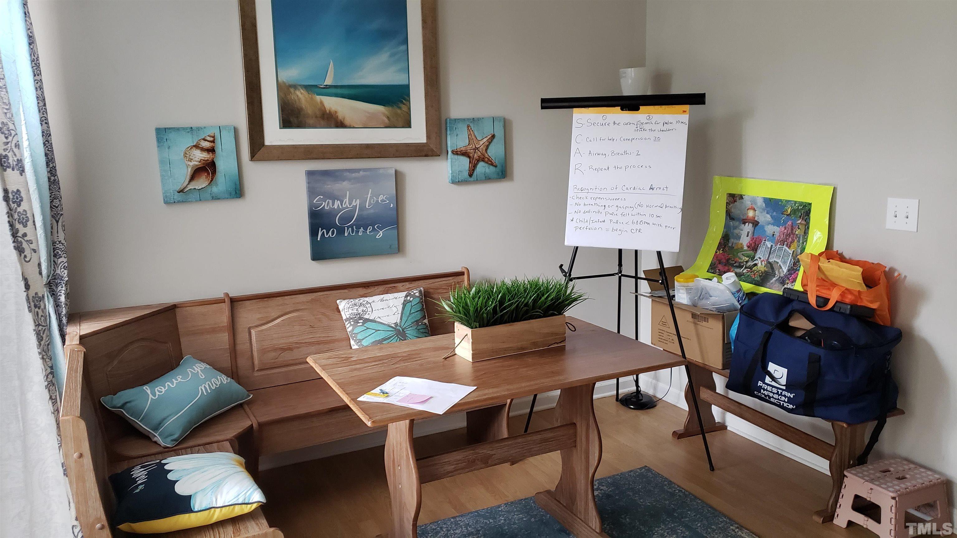 4125 Standing Rock Way Raleigh, NC 27604 - Photo 5 of 11 a view of a dining room with furniture and wooden floor