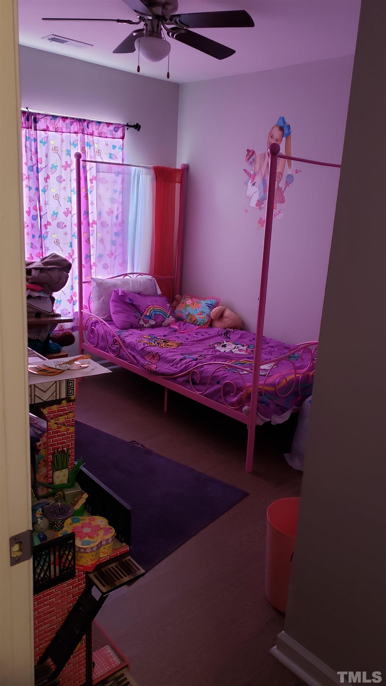 4125 Standing Rock Way Raleigh, NC 27604 - Photo 10 of 11 a bedroom with a bed and a window