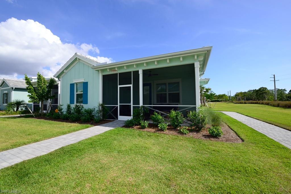 7299 Cayo Coco Lane Naples, FL 34113 - Photo 11 of 18 a view of a house with garden and yard