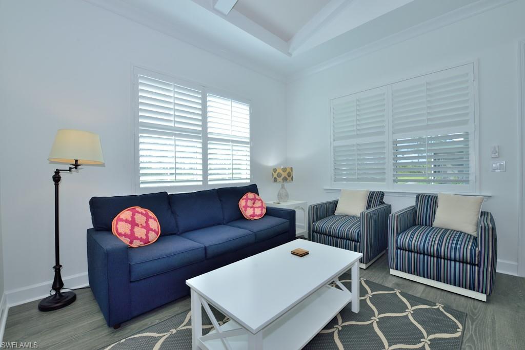 7299 Cayo Coco Lane Naples, FL 34113 - Photo 4 of 18 a living room with furniture and a window